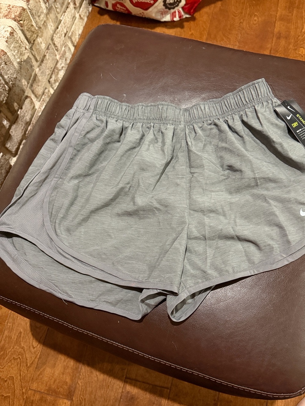 Nike Women's Light Gray Athletic Shorts with Swoosh